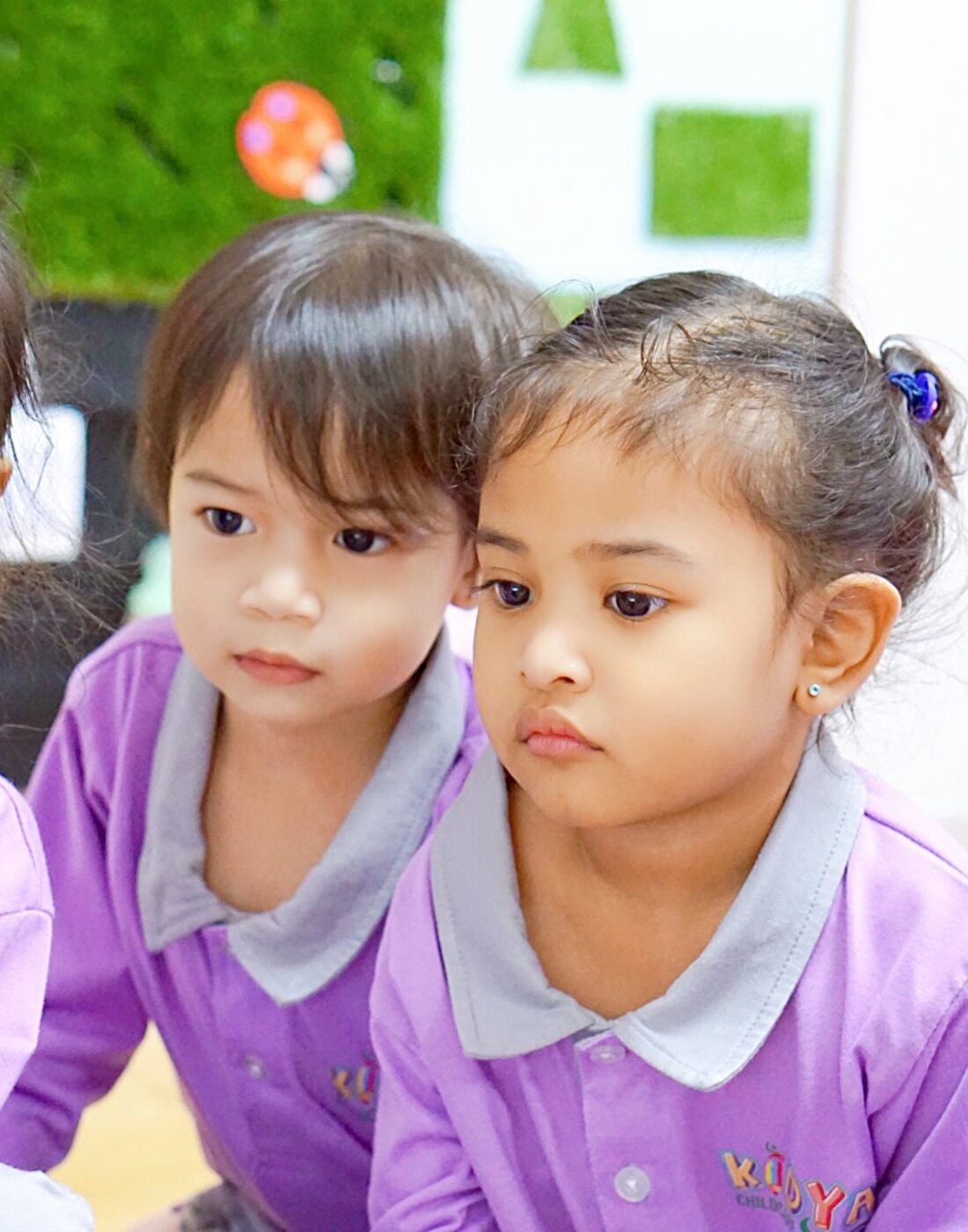 Three children in Kidya Childcare uniforms