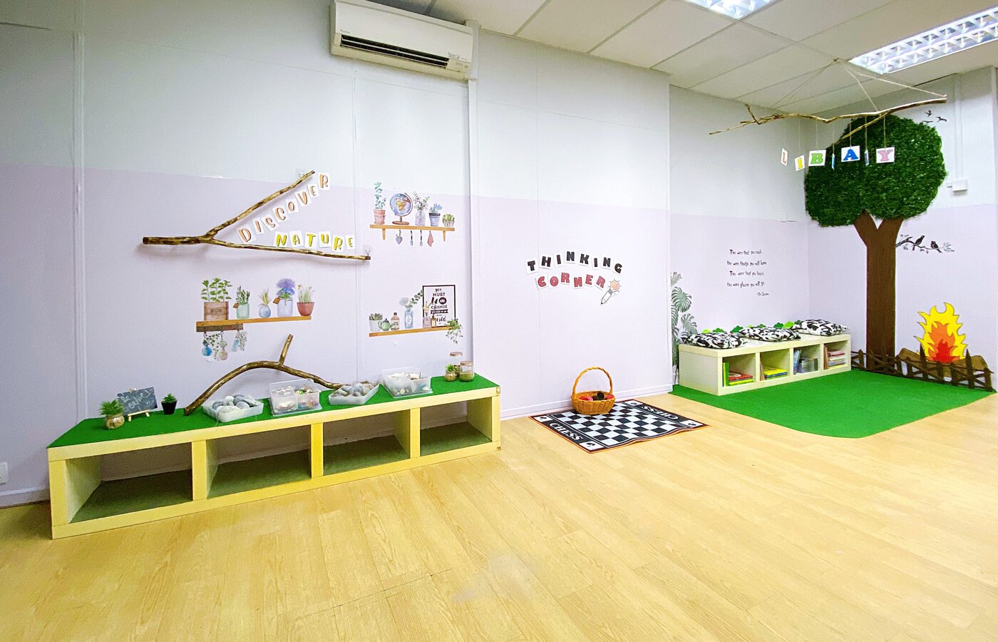 A Kidya Childcare classroom with low wooden shelves