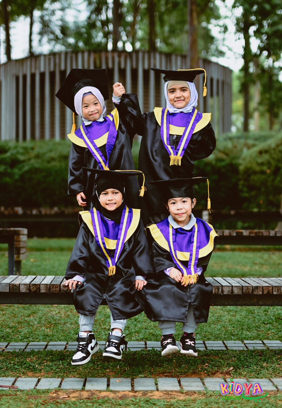 Kidya Childcare graduates in gowns